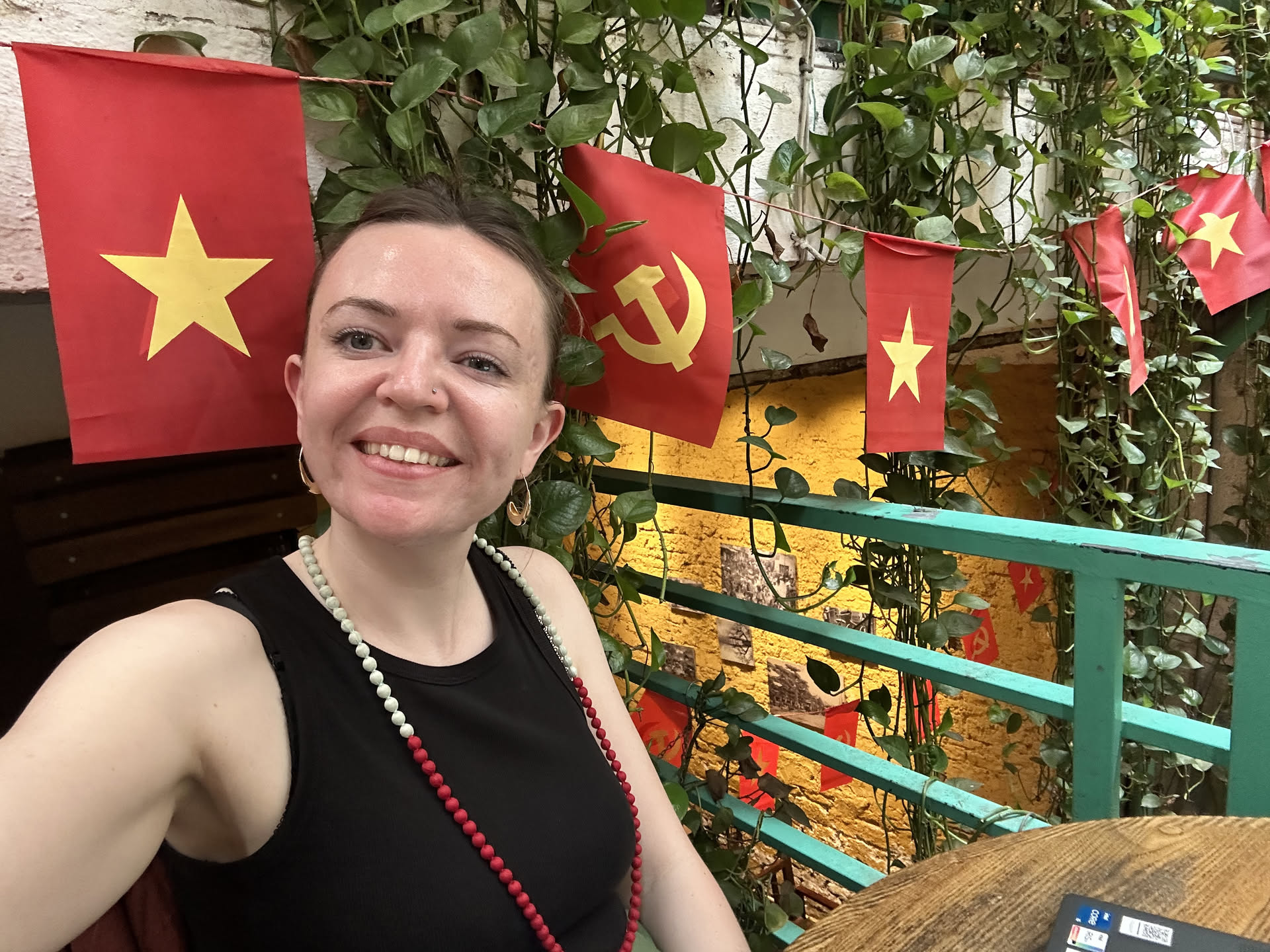 Heather at a colourful café while travelling