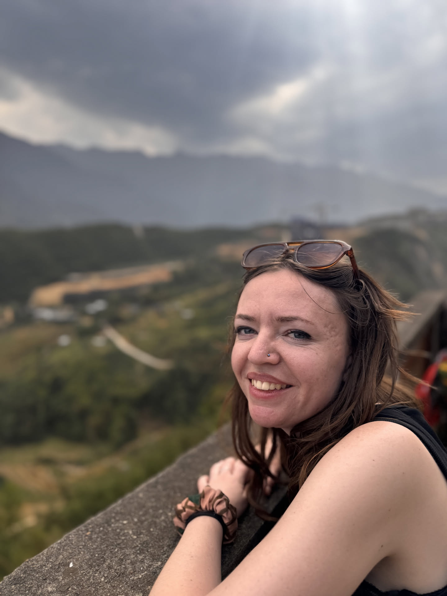 Heather enjoying a mountain view on her travels